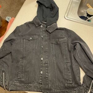 Black denim jean jacket with removable hood.